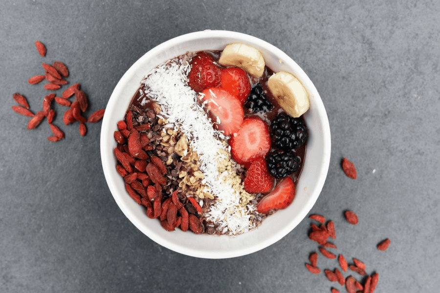 oatmeal breakfast bowl with fruit and acai - How Showering Less Helped Me Appreciate My Body More